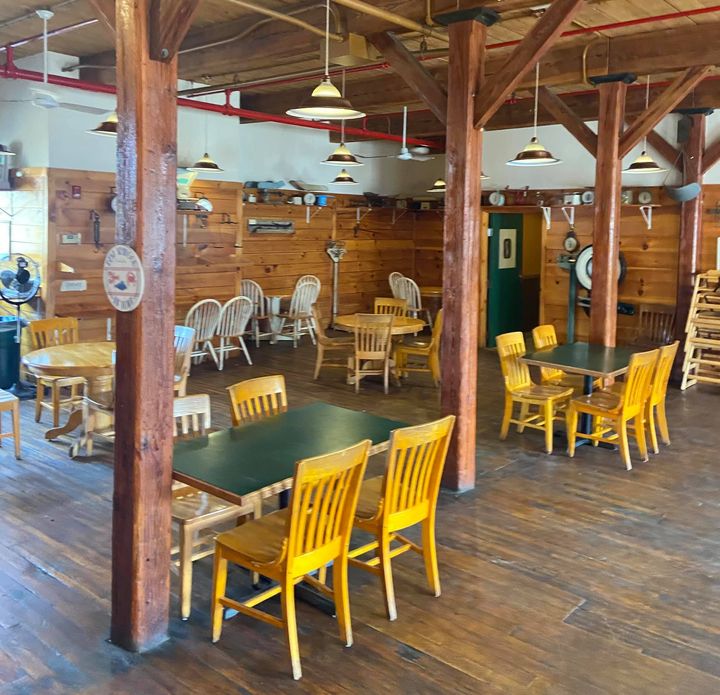 Interior of the restaurant, with tables and chairs.