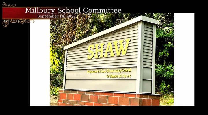 A screenshot of the School Committee meeting, displays an image of the sign for the Shaw School.