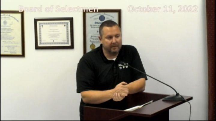 A man at a podium.